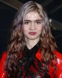 Grimes Unveils Eye-Catching Face Tattoo
