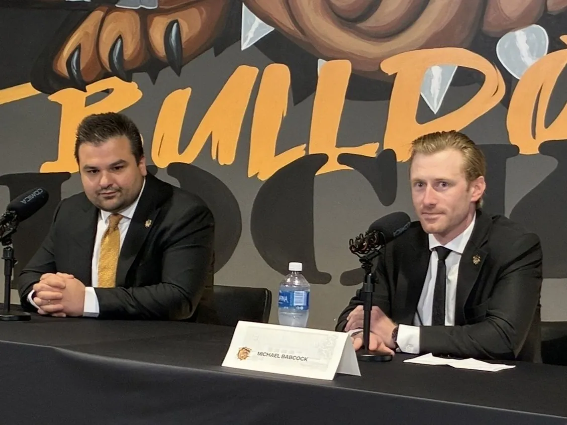 Brantford Bulldogs general manager Spencer Hyman (left) looks on as new head coach Michael Babcock speaks during a press conference on Tuesday at the TD Civic Centre. Hyman and company are set for this weekend's OHL draft.
