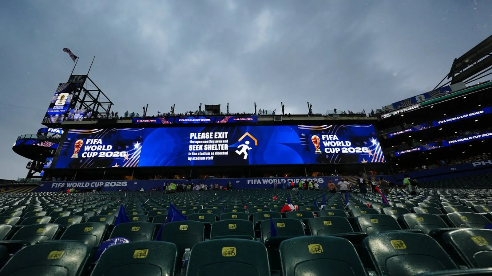 A sign advising fans of a weather delay is displayed during the World Cup Group I soccer match between France and Iraq in Philadelphia, Monday, June 22, 2026.